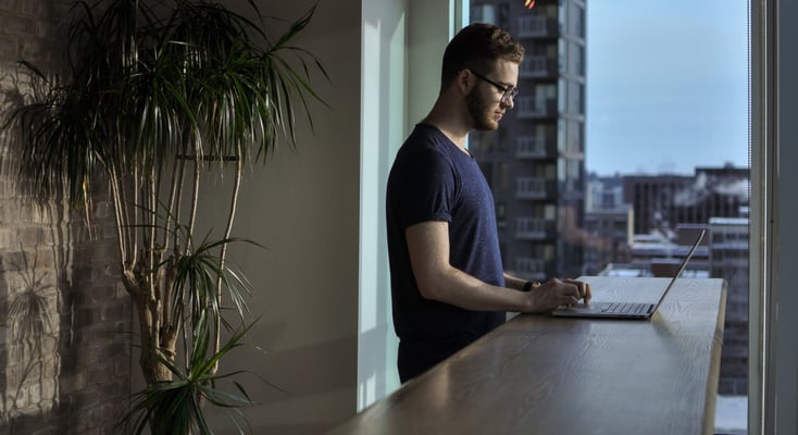 Man checking laptop for conversational UI