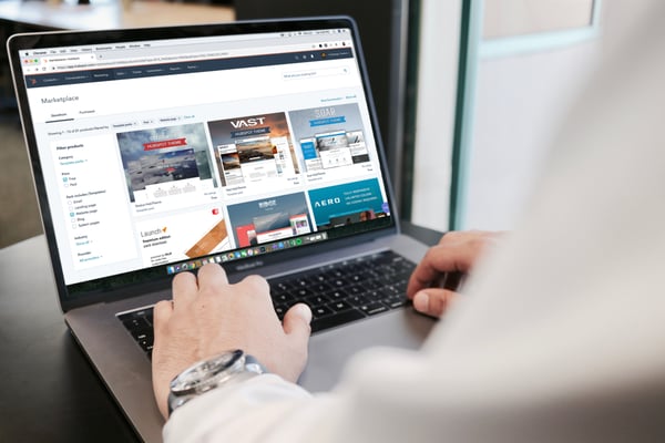 a person viewing a website on a laptop